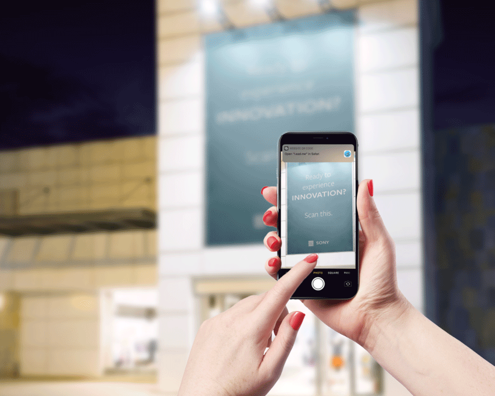 person interacting with Sony interactive billboard